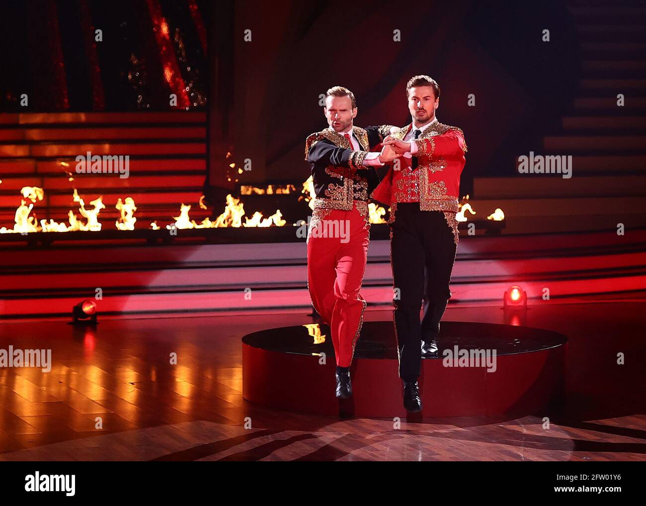 Cologne, Germany. 21st May, 2021. TV actor Nicolas Puschmann and professional dancer Vadim Garbuzov (l) dance a Paso Doble on the RTL dance show 'Let's Dance'. Credit: Rolf Vennenbernd/dpa-Pool/dpa/Alamy Live News Stock Photo