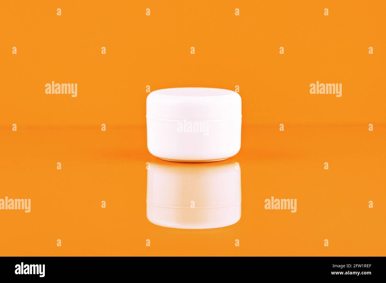 Unbranded plastic jar for cosmetics products. Skincare and cosmetology mockup. Branding identity mockup concept Stock Photo