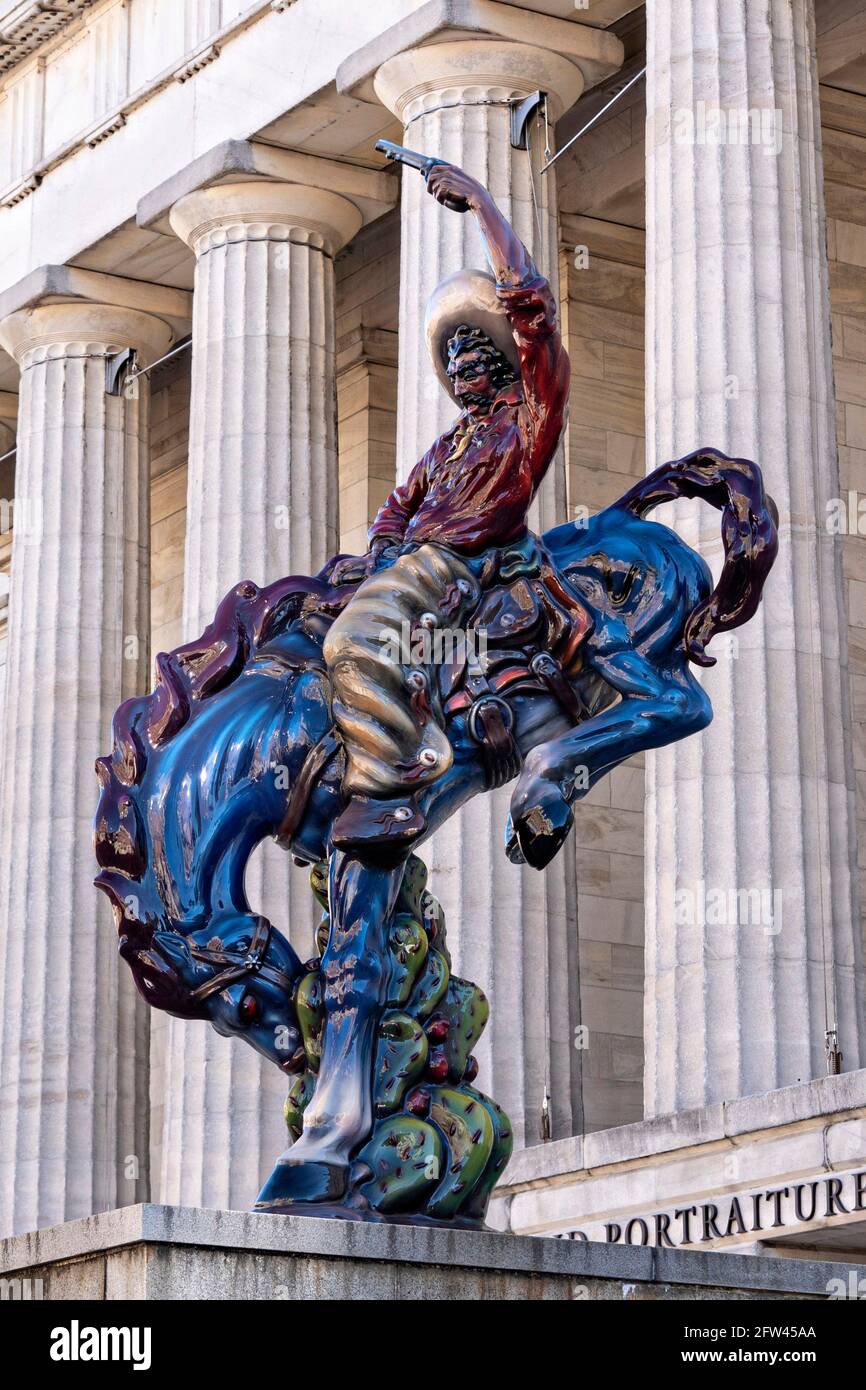 Vaquero, an acrylic, fiberglass and steel sculpture by American artist Luis Jimenez, outside the Smithsonian American Art Museum in Washington, DC. Stock Photo