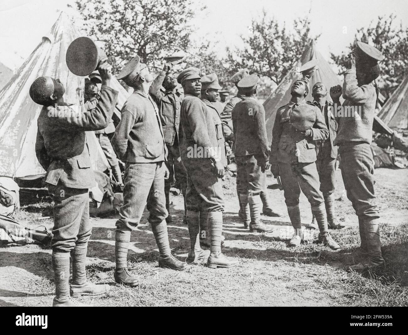 World War One, WWI, Western Front - Men from a West Indian Regiment watch German aeroplane being chased by British planes, France Stock Photo