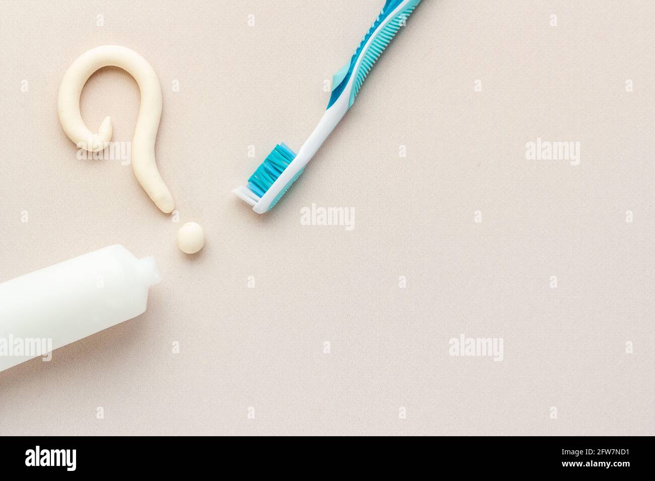 Question Mark With Toothpaste Question mark of toothpaste with toothbrush, top view. Oral care and ...