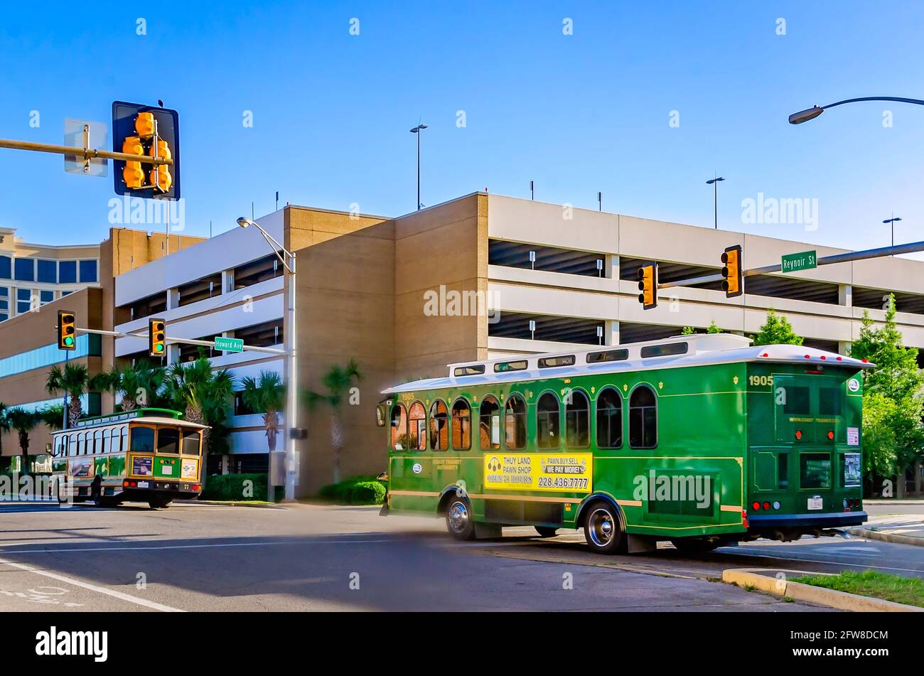 Trolleys with the Coastal Transit Authority drive down Reynoir Street, May  8, 2021, in Biloxi, Mississippi Stock Photo - Alamy