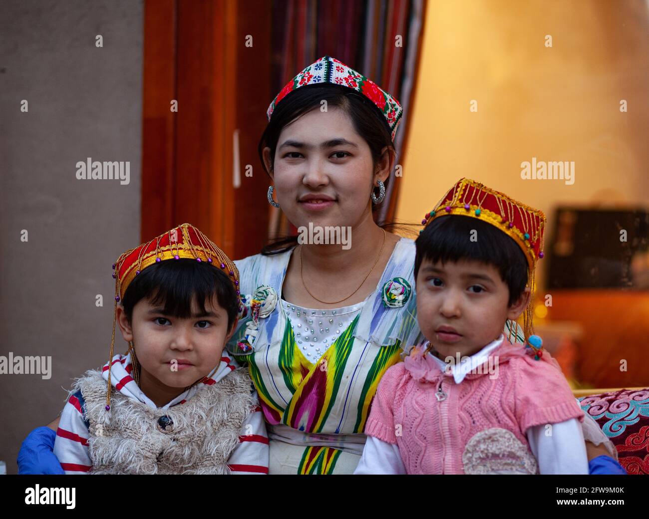 Young woman with her children Kashgar, Xinkiang, Popular Republic of China, 2019 Stock Photo