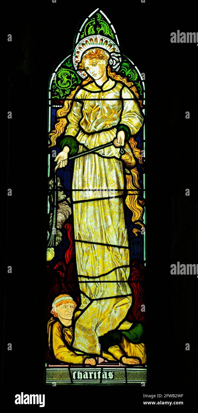 Charitas, Charity, stained glass window by Burne-Jones, 1865, Sculthorpe church, Norfolk, England UK, from 'Faith, Hope and Charity' window Stock Photo