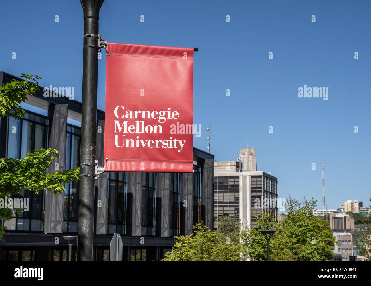 Pittsburgh, Pennsylvania, USA- May 13, 2021: Carnegie Mellon University campus entrance sign with buildings in the background.  CMU is a private resea Stock Photo