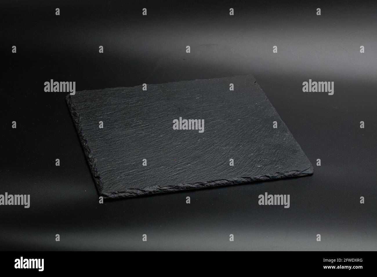 Black stone table plate for kitchen isolated Stock Photo