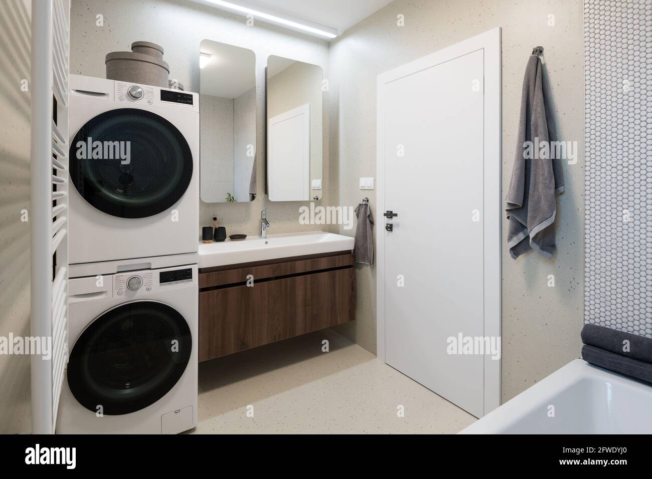 Interior of contemporary bathroom with washing machine and dryer Stock  Photo - Alamy