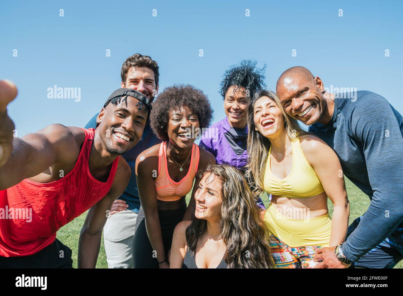 Group of runners taking a selfie in a park. Happy and smiling. Stock Photo