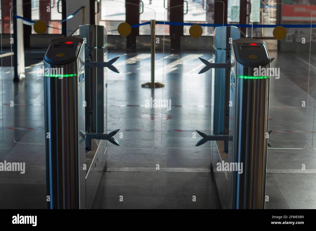 Turnstile for entry and exit with tickets Stock Photo - Alamy