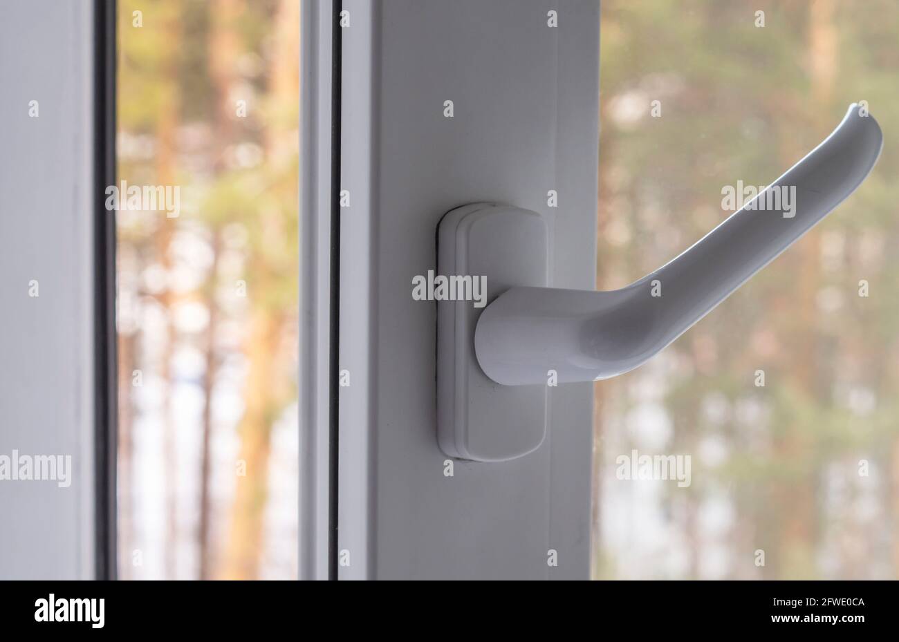 open plastic window on a forest background Stock Photo