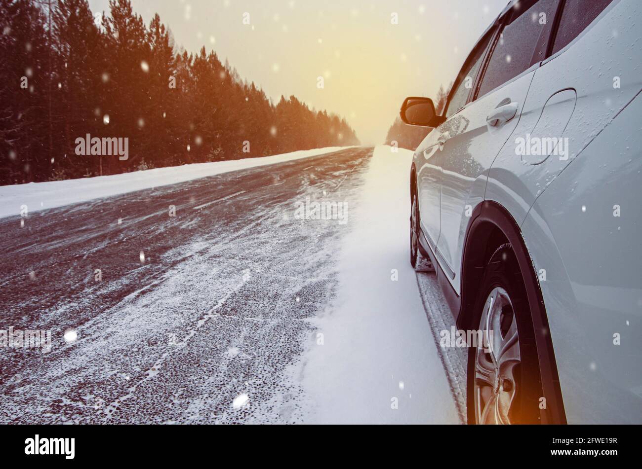 White car standing on the road with copy space Stock Photo