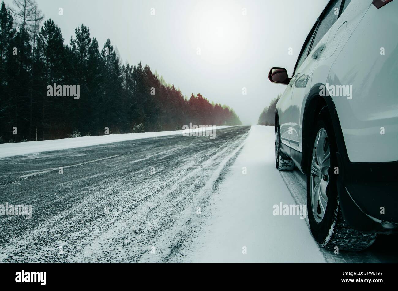 White car standing on the road with copy space Stock Photo