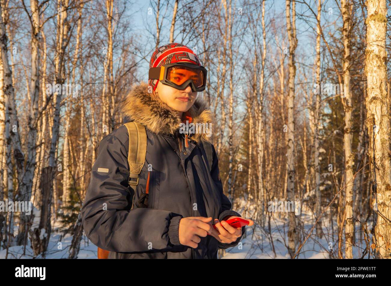 Young teenage man using smartphone for video call Stock Photo