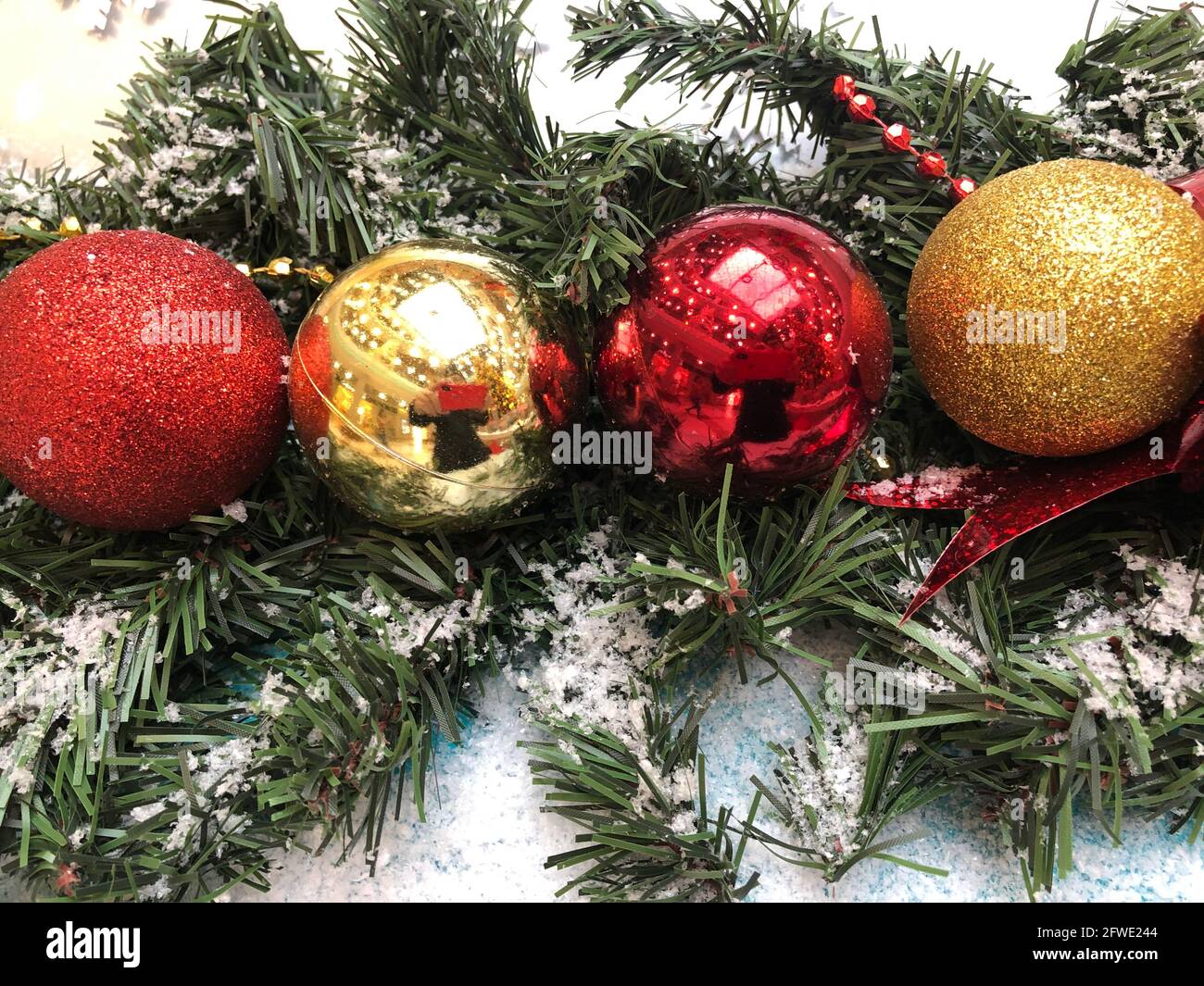 Silver christmas baubles in the snow hi-res stock photography and ...