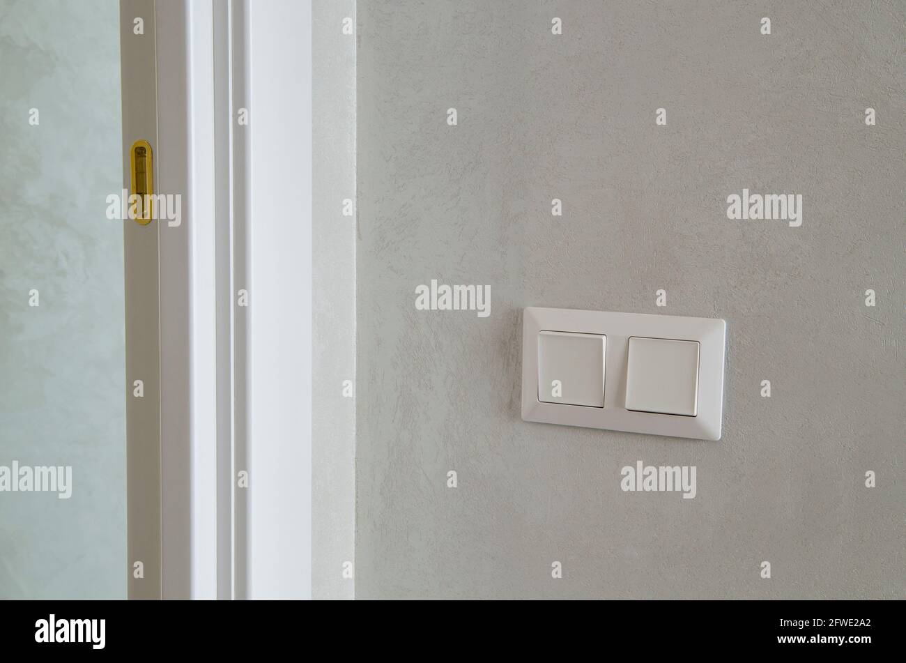 Modern light switch on the wall in the room Stock Photo Alamy