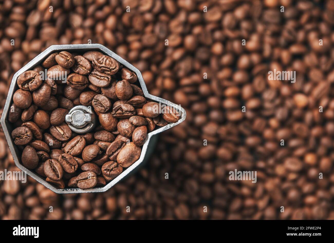Top view on mocha pot full with coffee beans. Coffee background concept. Stock Photo