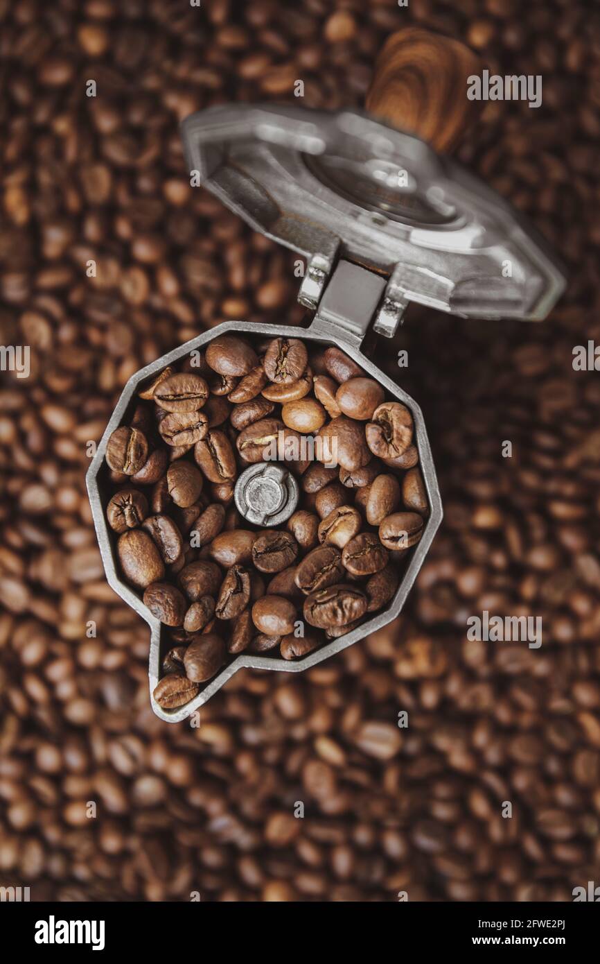 Top view on mocha pot full with coffee beans. Coffee background concept. Stock Photo