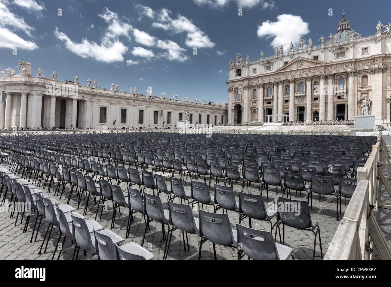 Empty seats in front of St Peter cathedral in Vatican Stock Photo