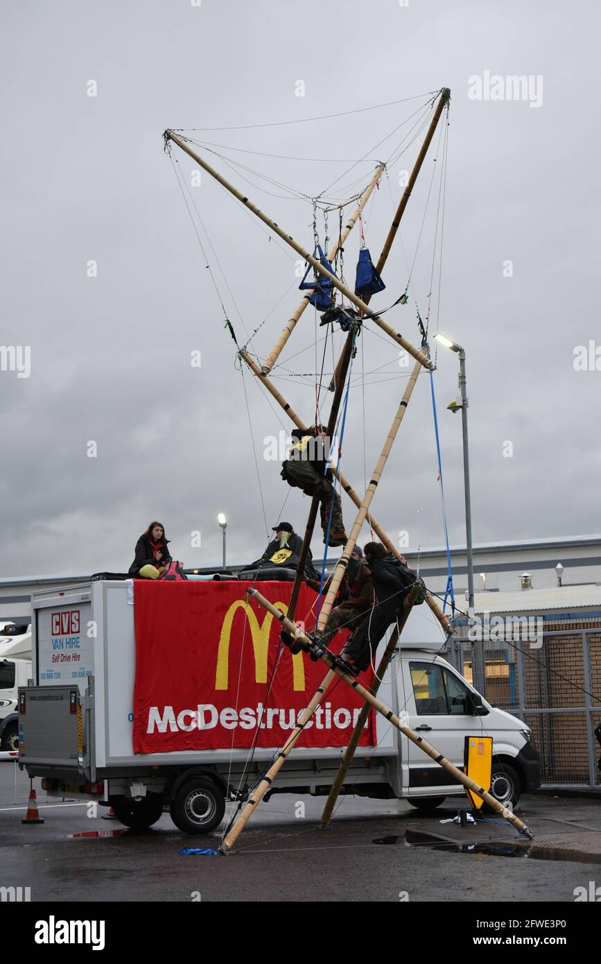 Basingstoke, UK. 22 May 2021. Animal Rebellion (part of Extinction Rebellion) activists stage a blockade outside McDonald's distribution centre in Basingstoke. Protesters blocked the entrances to the depot with wooden structures. Credit: Andrea Domeniconi/Alamy Live News Stock Photo