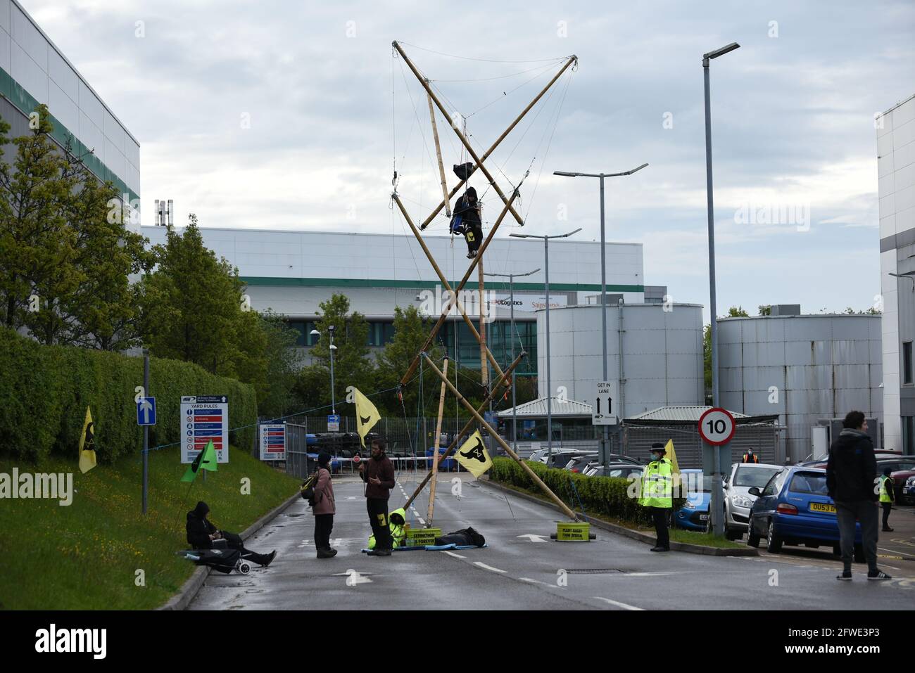 Basingstoke, UK. 22 May 2021. Animal Rebellion (part of Extinction Rebellion) activists stage a blockade outside McDonald's distribution centre in Basingstoke. Protesters blocked the entrances to the depot with wooden structures. Credit: Andrea Domeniconi/Alamy Live News Stock Photo