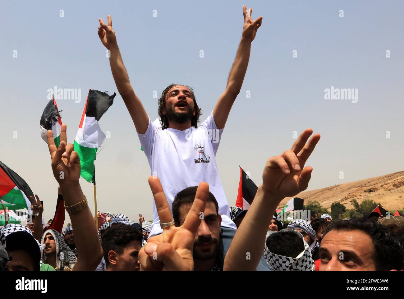 Al Karama. 22nd May, 2021. People celebrate the ceasefire between Israel and Hamas near the Al
