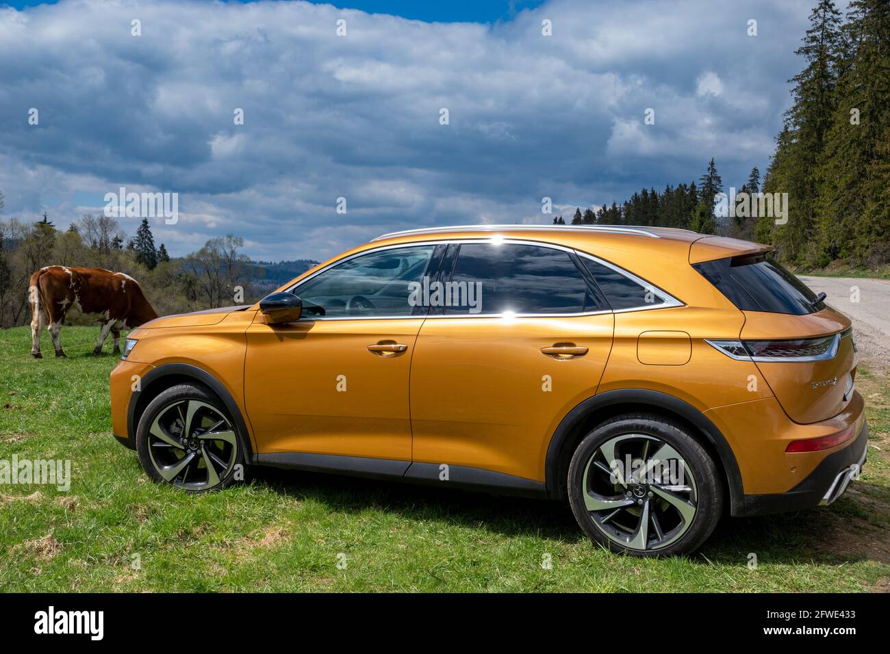 DS 7 Crossback E-Tense 4x4 hybrid on the background of rural landscape Stock Photo