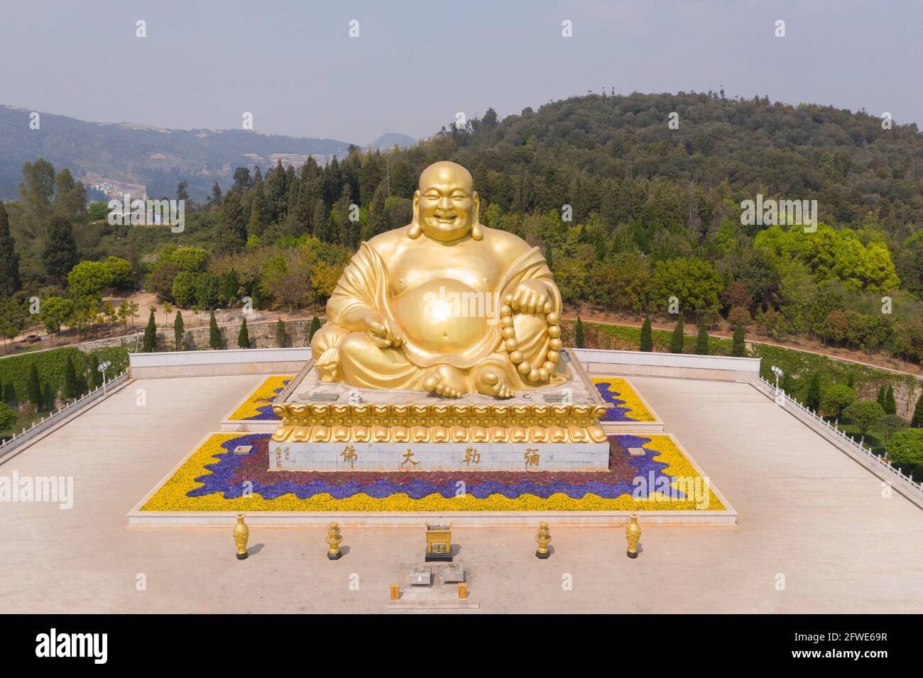 Aerial view of Giant Happy Buddha in Jinpingshan park in Mile city near Kunming, in Yunnan - China Stock Photo