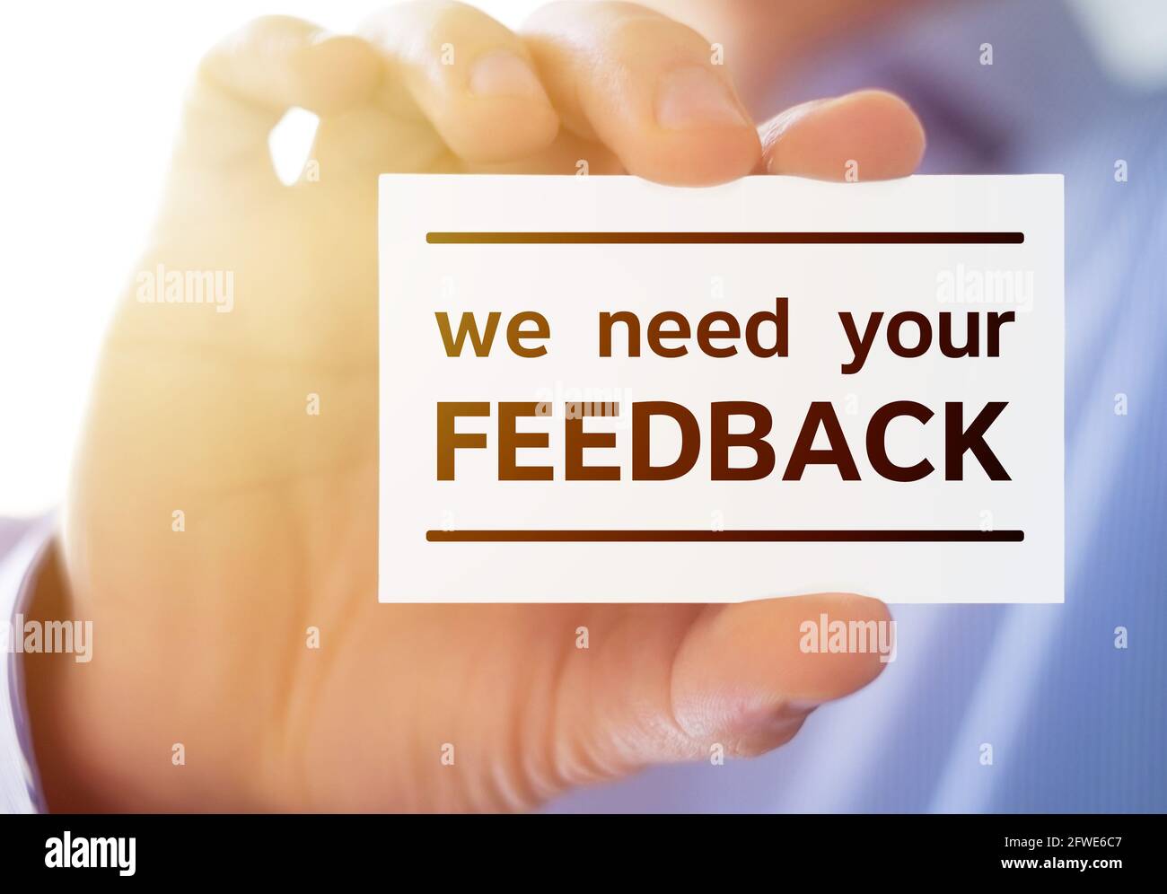 Business card message - we need your feedback Stock Photo
