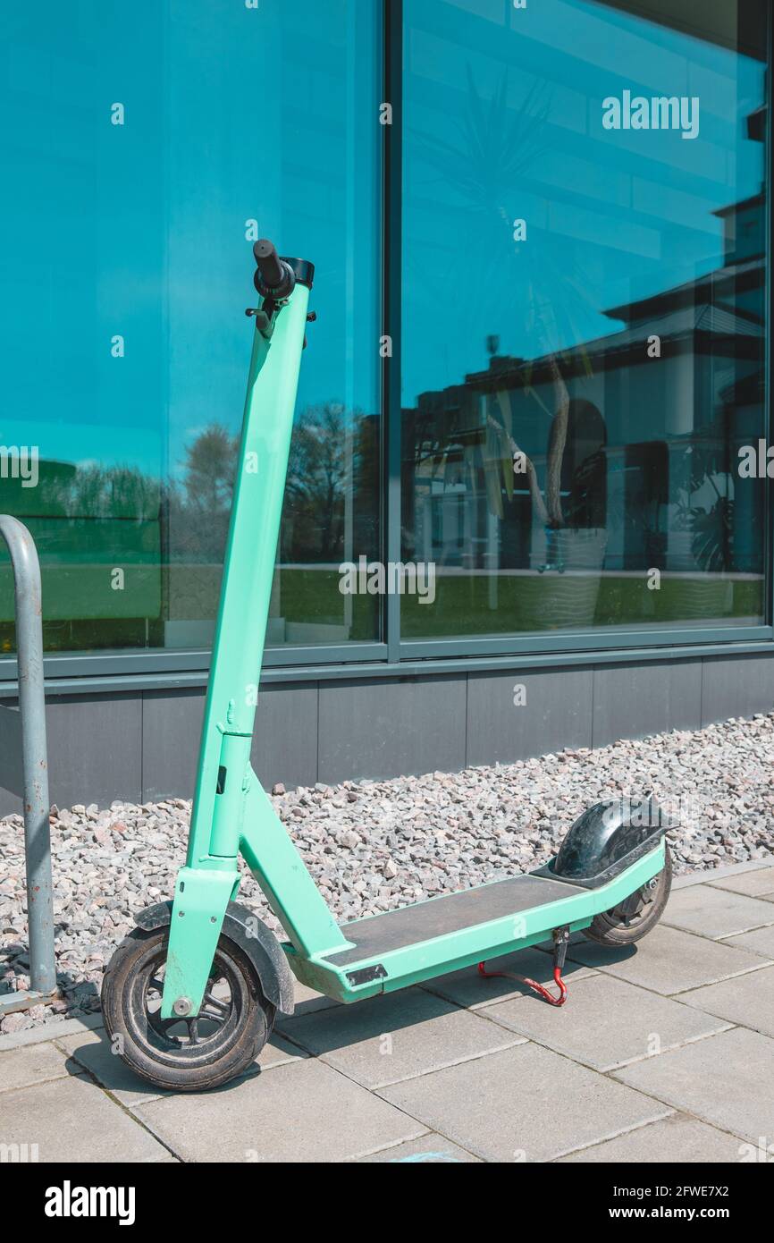 rental electric scooter at city near office building Photo - Alamy