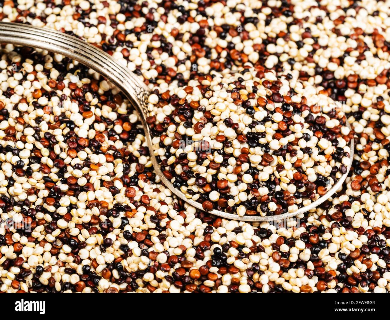old tablespoon in mix of quinoa seeds close up Stock Photo Alamy
