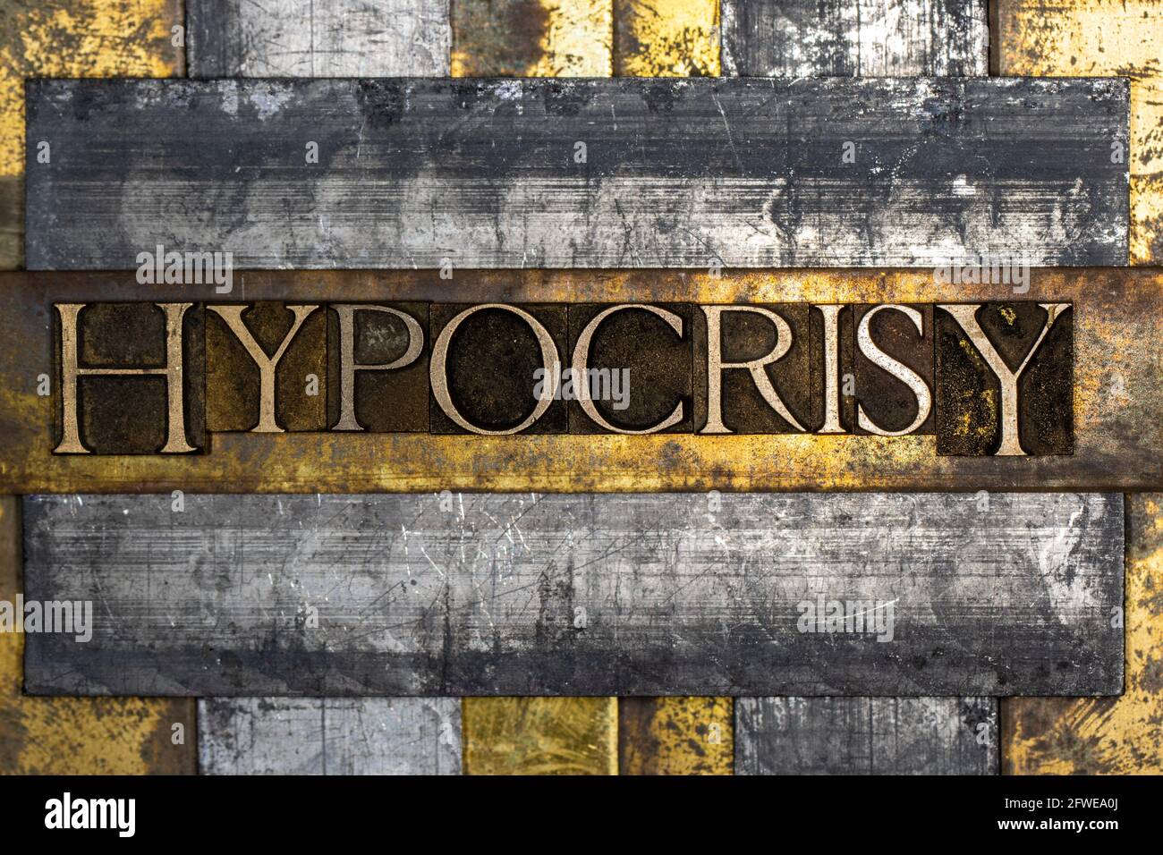 Hypocrisy text on vintage textured grunge copper and gold background Stock Photo