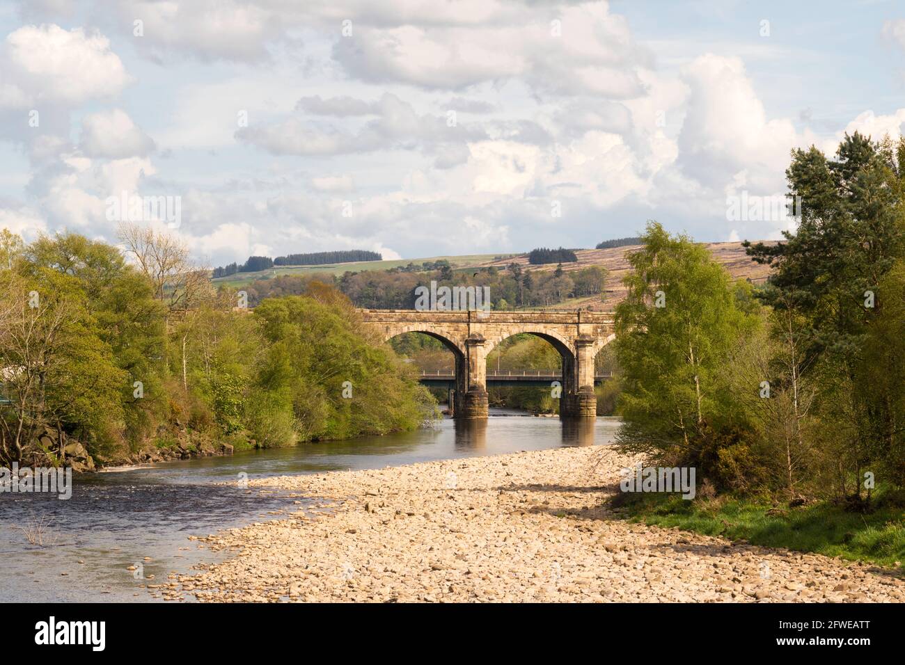 The old stone railway viaduct at Haltwhistle crossing the river South Tyne in Northumberland, England, UK Stock Photo