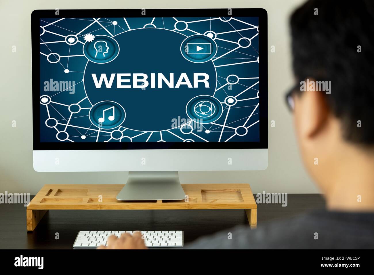 WEBINAR hand on table use E-business Browsing Connection in computer  Webinar with person on laptop display conference, webinar Stock Photo
