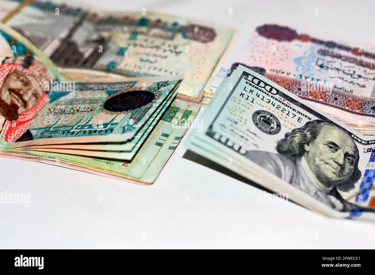 collection-of-us-dollars-egyptian-pounds-and-saudi-riyals-background-100-dollar-banknotes-50-egyptian-pounds-banknote-100-egyptian-pounds-and-20-2FWECC1.jpg