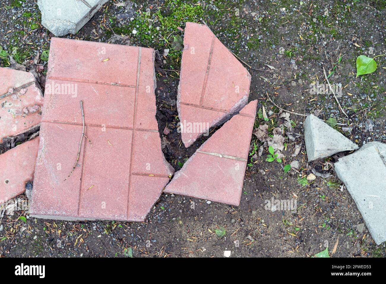 Broken paving slabs on the footpath Stock Photo Alamy