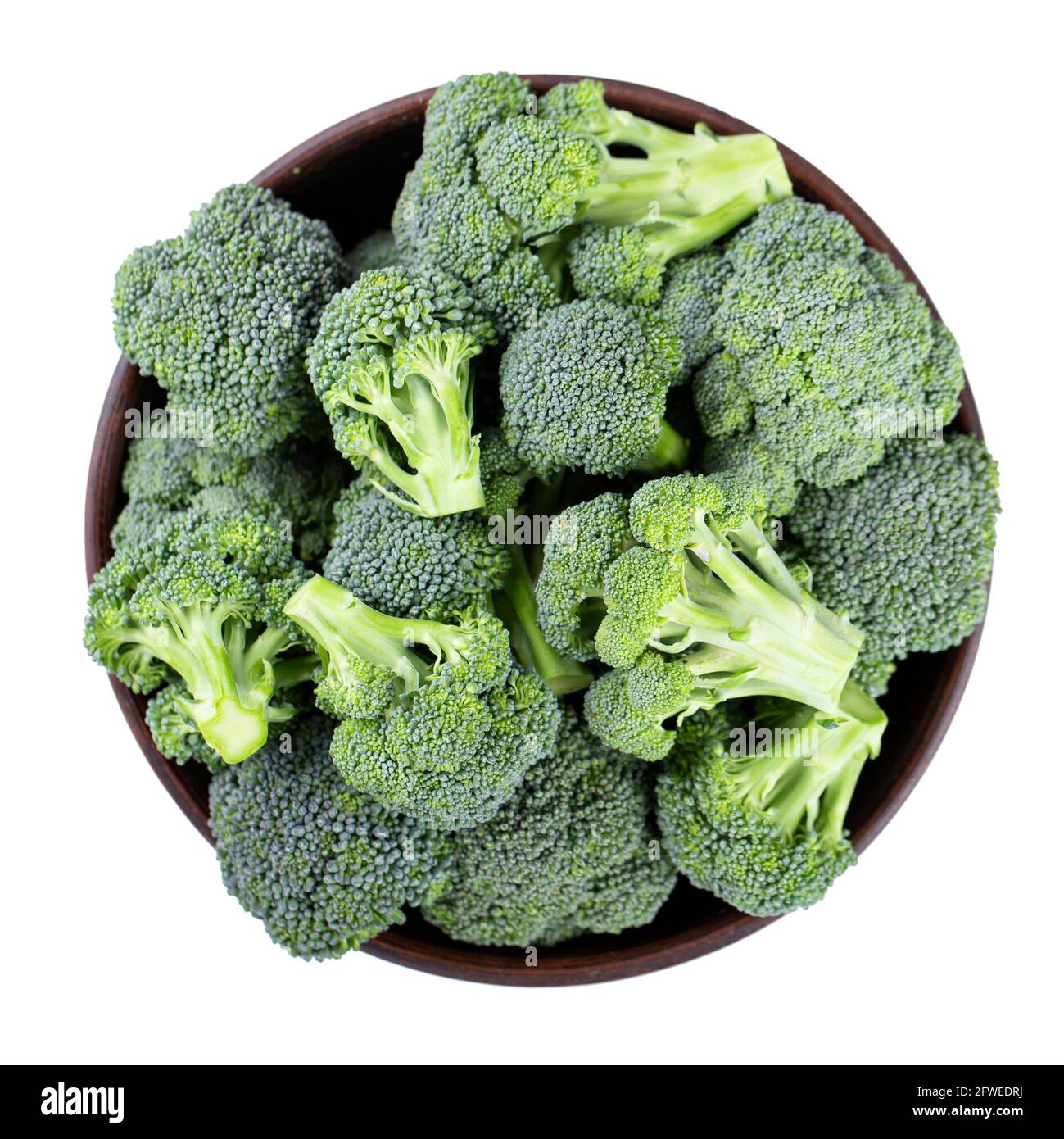 Fresh broccoli in a clay bowl isolated on white background. File ...