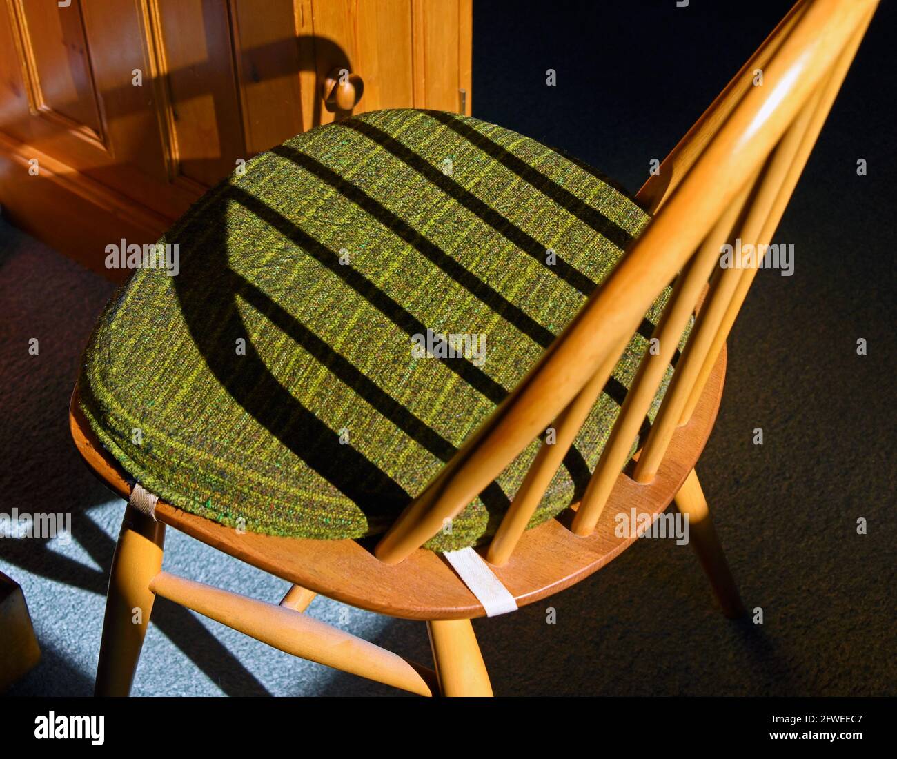 Ercol Windsor dining chair with shadows. Stock Photo