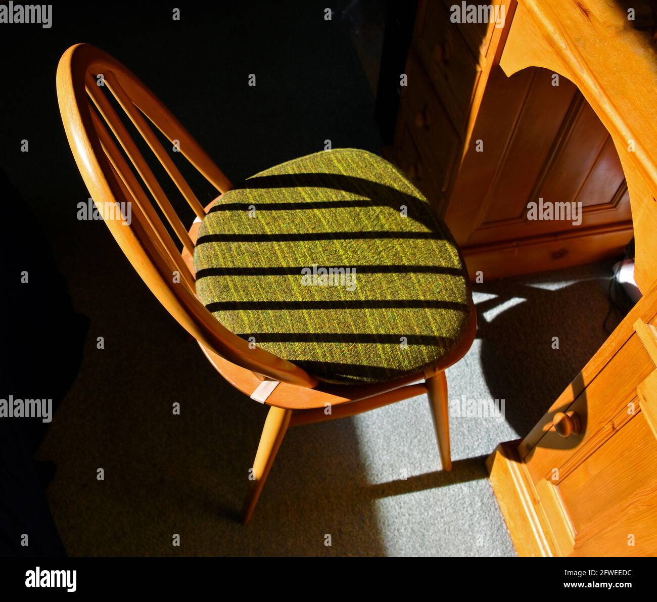 Ercol Windsor dining chair with shadows. Stock Photo
