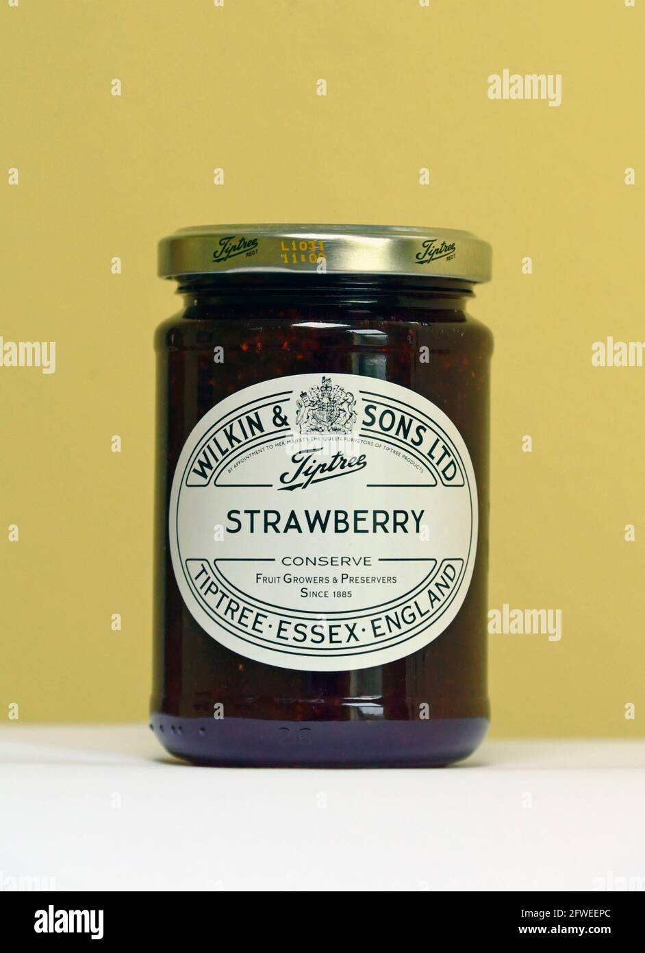 Jar of Tiptree Strawberry Conserve. Wilkin & Sons Ltd. Tiptree, Essex, England. Fruit Growers & Preservers Since 1885. Stock Photo