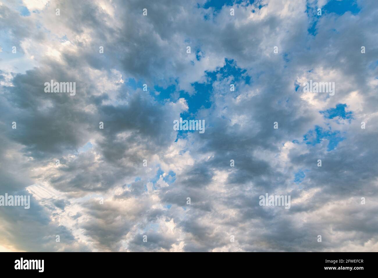 Amazing cloudscape on the sky at sunset time after rain Stock Photo - Alamy