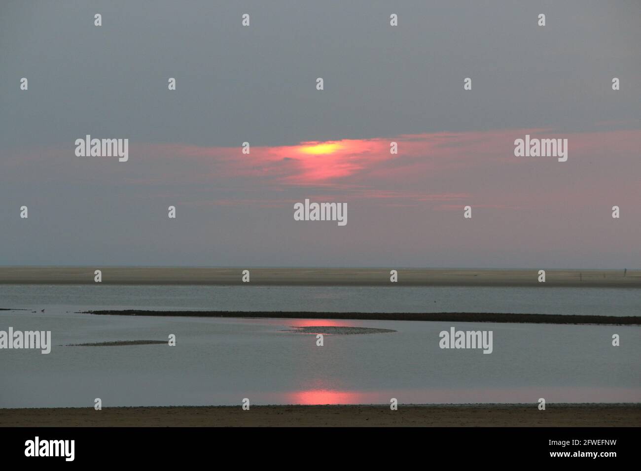 Sunset at a beach at the North Sea Stock Photo - Alamy