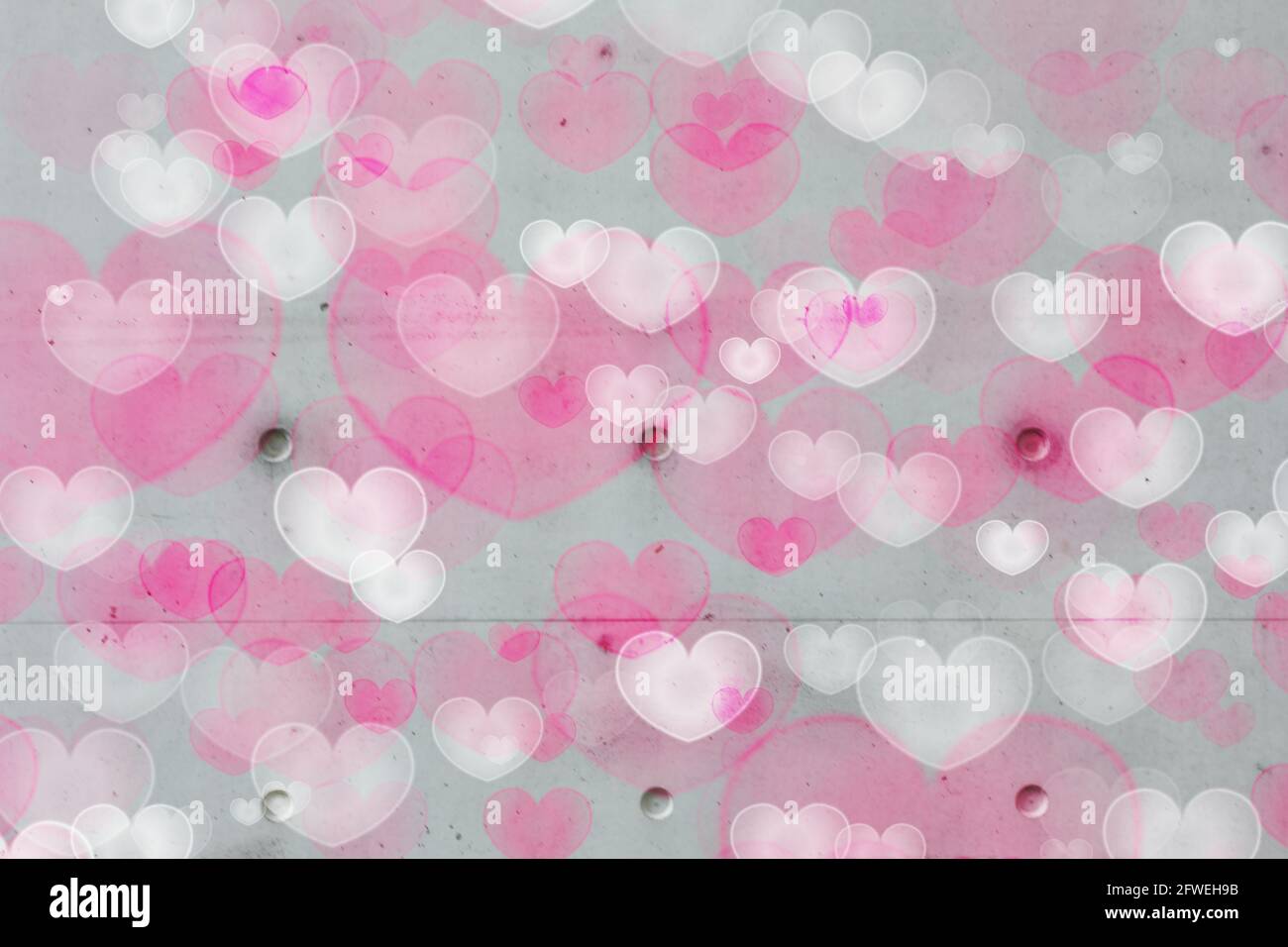 Background hearts white pink concrete wall Stock Photo