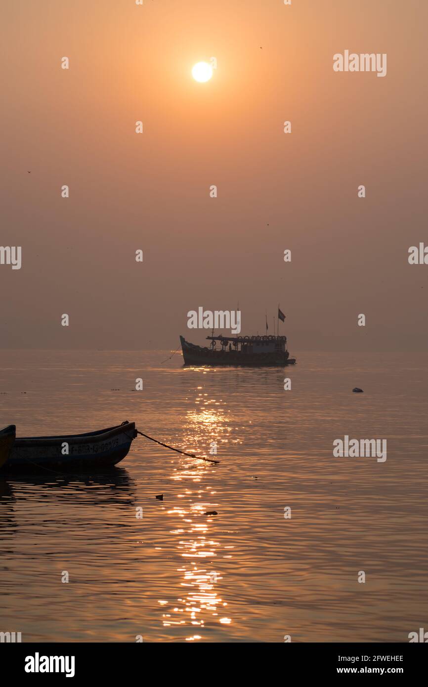 Killeshwar Sihouette of boat sailing in sunset in Mumbai beach at killeshwar ...