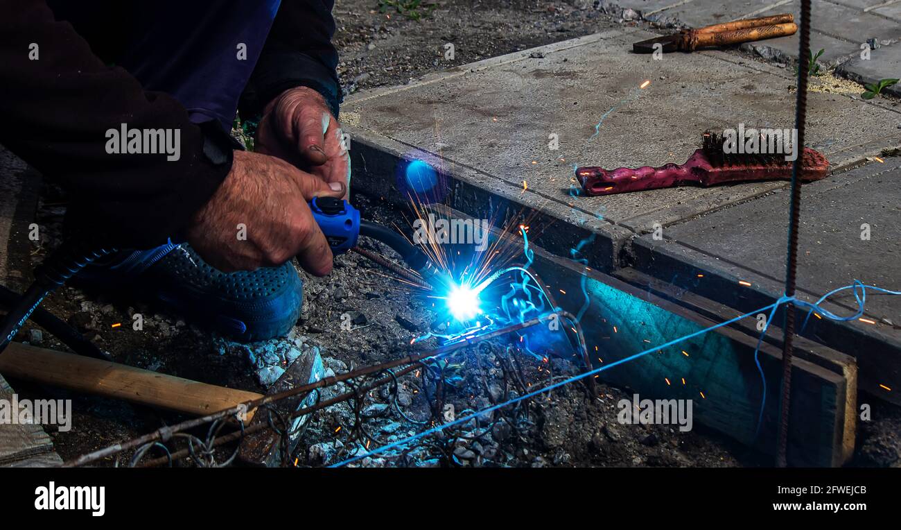 Welder Welding Steel Bars Rebar, Selective Focus Stock Photo