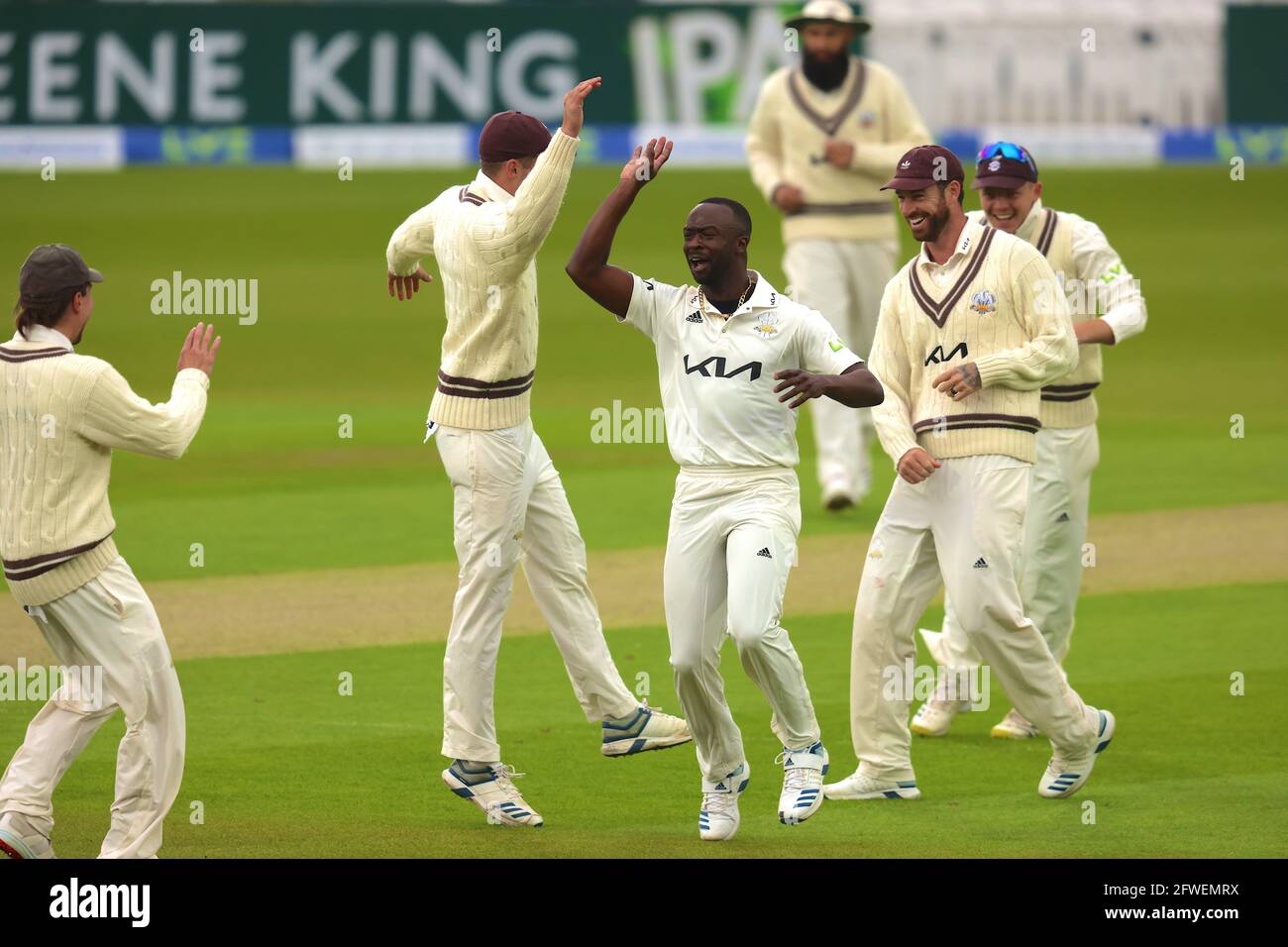 22 May, 2021. London, UK. Surrey’s Kemar Roach celebrates with team mates after getting the wicket of Sam Robson as Surrey take on Middlesex in  the County Championship at the Kia Oval, day three David Rowe/Alamy Live News Stock Photo