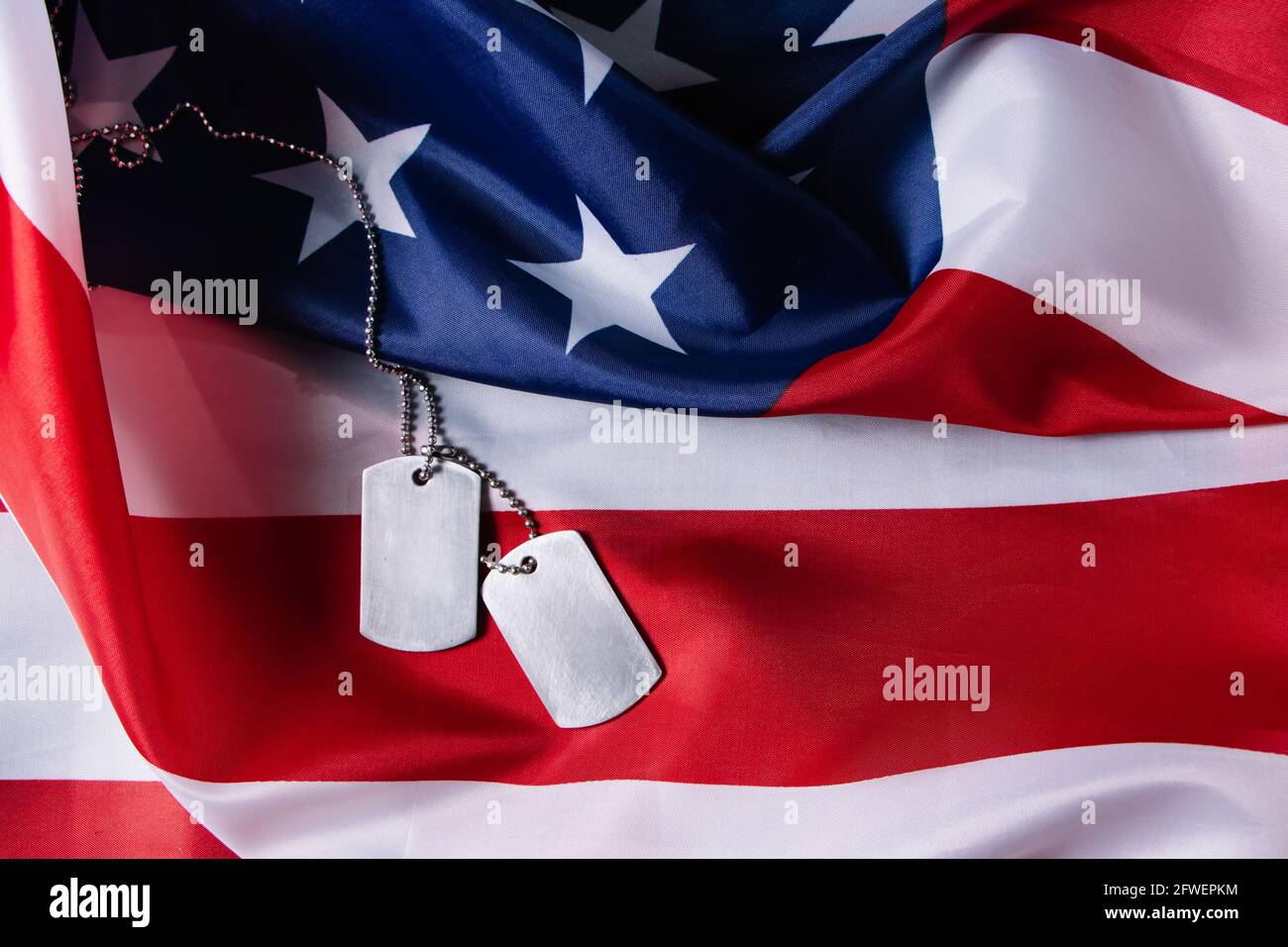 American flag and military dog tags close up. USA Memorial Day concept ...