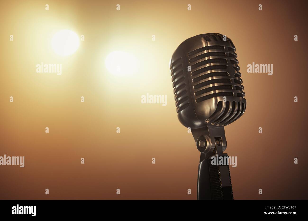 Close up of a retro microphone at the stage with copy space Stock Photo
