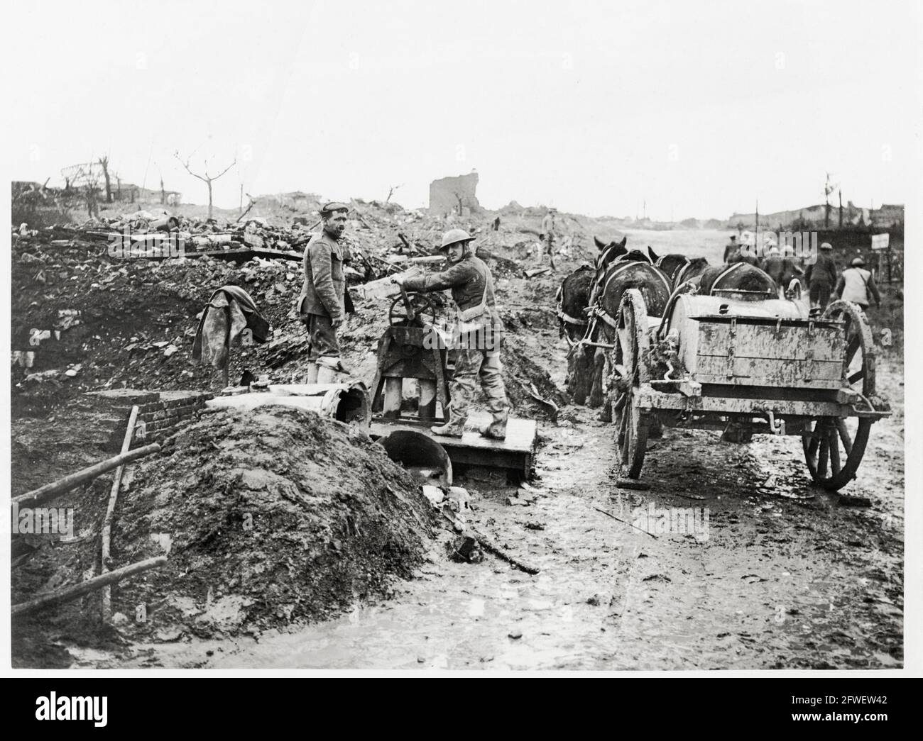 World War One, WWI, Western Front - Men drawing water in a captured and damaged village, France Stock Photo