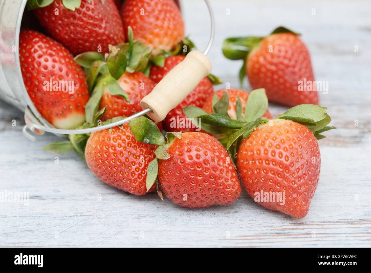 Strawberries lying on wood Stock Photo