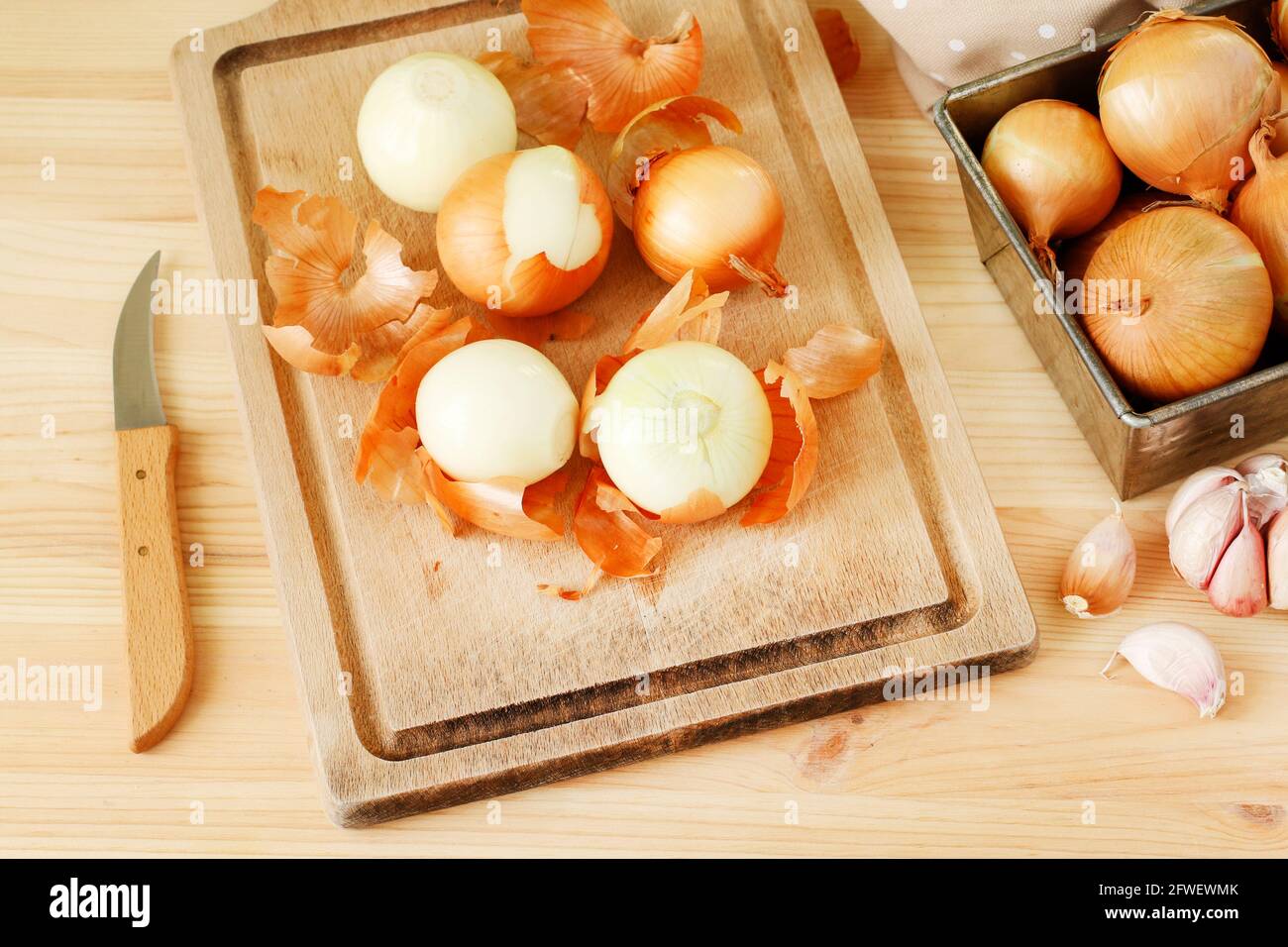 Woman peeling onion table hi-res stock photography and images - Alamy
